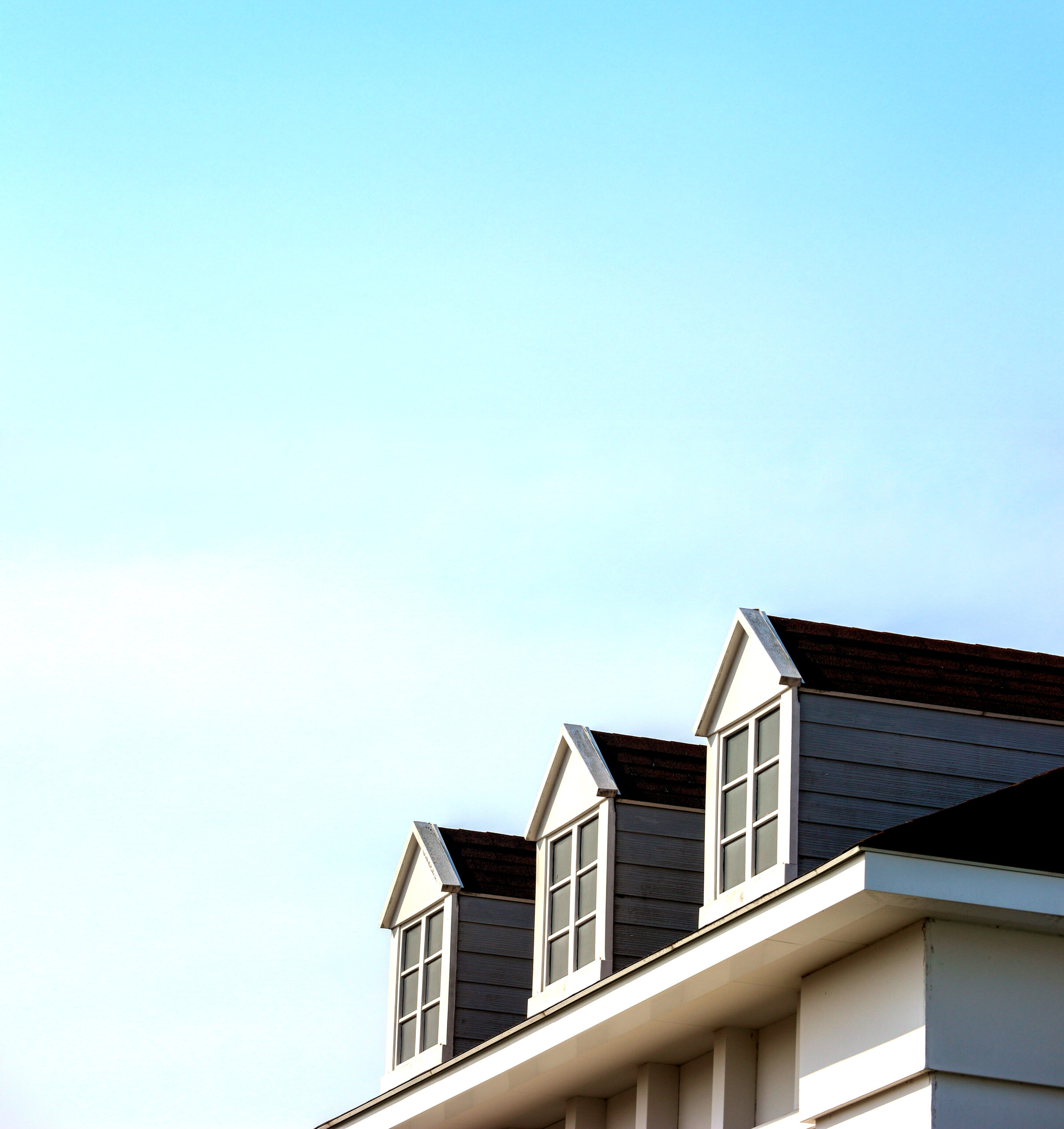 perspective view of modern gable roof design house wall with eve